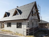 New build houses. Black roof, mountain